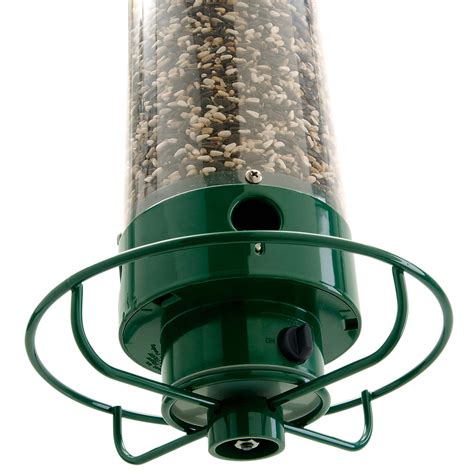 Spinning bird feeder - Another key feature is placement. Hang feeders at least 6 feet off the ground and 10 feet away from any structures or trees that could allow deer to jump onto them. Ideally, place them near cover such as bushes or shrubs where birds can hide if threatened but still have access to their food source.
